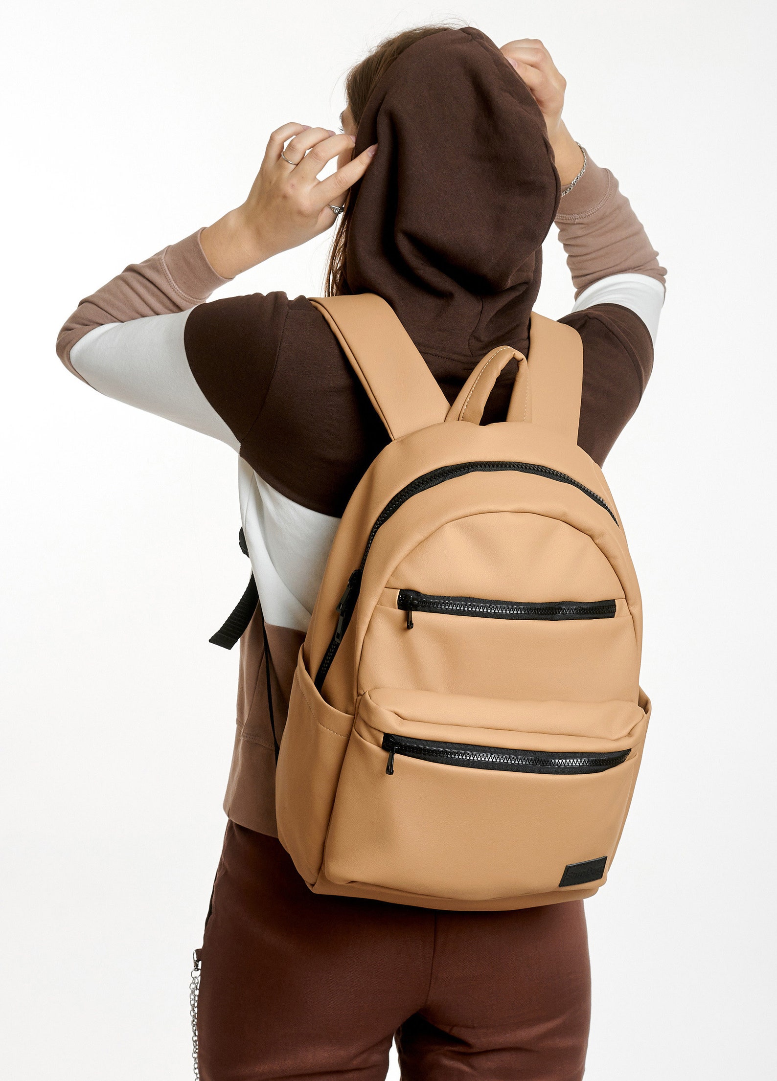 small beige travel backpack