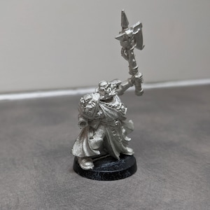 Space Marine commander with missing hand battle axe and backpack