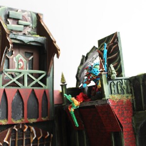 Set che rappresenta un edificio futuristico per giochi da tavolo come Warhammer immagine 4