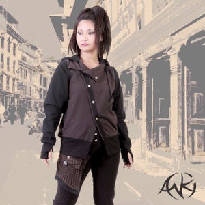 May include: A brown and black hooded jacket with a zipper and button closure. The jacket has a black and white plaid pattern on the bottom.