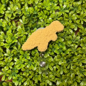 Dinosaur Nugget Badge Reel
