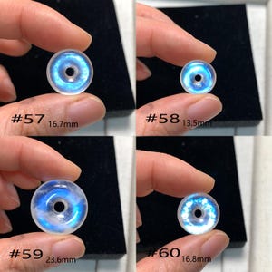 May include: Four iridescent white gemstone donut beads with a blue centre. The beads are labelled #57, #58, #59, and #60 with their respective diameters in millimetres.
