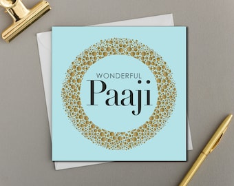 May include: A light blue card with a gold glitter circle design. The text "Wonderful Paaji" is in the center of the circle.