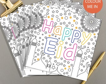 May include: A stack of blank greeting cards with a black and white illustration of a mosque, stars, and the text "Happy Eid". The cards are ready to be colored in.