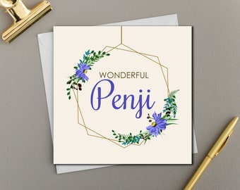 May include: A white card with a gold geometric frame and purple flowers. The text "Wonderful Penji" is inside the frame.