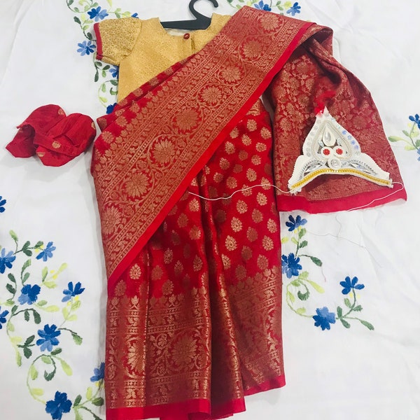 Ready to wear saree with blouse , booties and mukut for rice ceremony .
