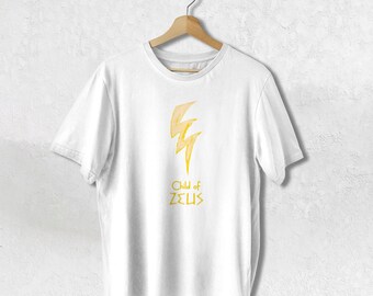 May include: White t-shirt with a yellow lightning bolt graphic and the text "Child of ZEUS" in yellow.
