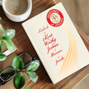 May include: A white notebook with the title "Notebook for Most Worthy Joshua of Heroines of Jericho" in red cursive writing. A red circle with the text "Heroines of Jericho" in white is in the top right corner.