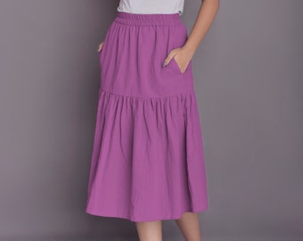 Falda midi de lino con volantes: falda fruncida con vuelo y bolsillos