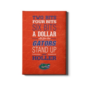 May include: Orange canvas print with a blue alligator logo and the text "TWO BITS FOUR BITS SIX BITS A DOLLAR All for the GATORS STAND UP and HOLLER"