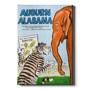 May include: A vintage illustration of a tiger holding a Boy Scout Manual titled "KNOTS" and an elephant looking down at the tiger. The text reads "Auburn Alabama, Legion Field-Birmingham, Ala. November 30, 1963, Official Auburn Program-50¢".