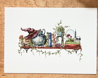 May include: A watercolor painting of a shelf with a witch's hat, cauldron, books, a skull, a candle, and a terrarium. The shelf is decorated with vines and flowers.