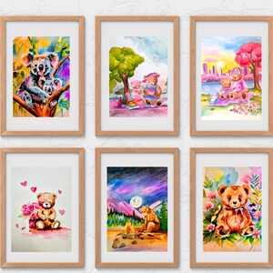May include: Six framed watercolour paintings featuring various animals. The first painting shows a koala and two baby koalas in a tree. The second painting shows two teddy bears having a picnic. The third painting shows two teddy bears sitting on a bench by a lake. The fourth painting shows a teddy bear holding a bouquet of flowers. The fifth painting shows a bear sitting by a campfire under a starry sky. The sixth painting shows a teddy bear sitting in a field of flowers.