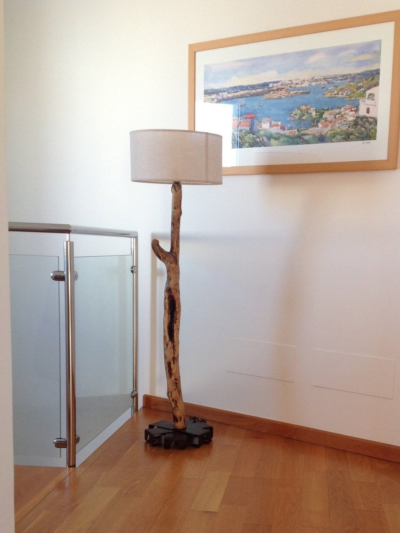 Floor Lamp Made With A Log Of Driftwood And Star Shaped Iron Base