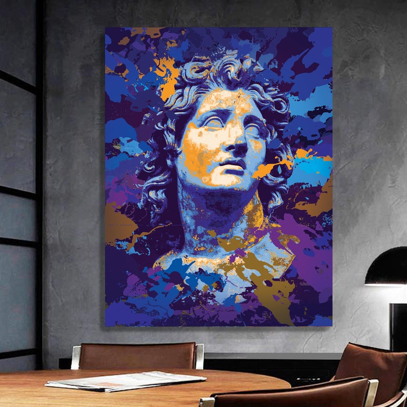 May include: A canvas print featuring a stylized bust of a classical figure. The artwork uses a vibrant color palette of blues, purples, and gold, with a splash effect. The figure's face is highlighted with orange tones.