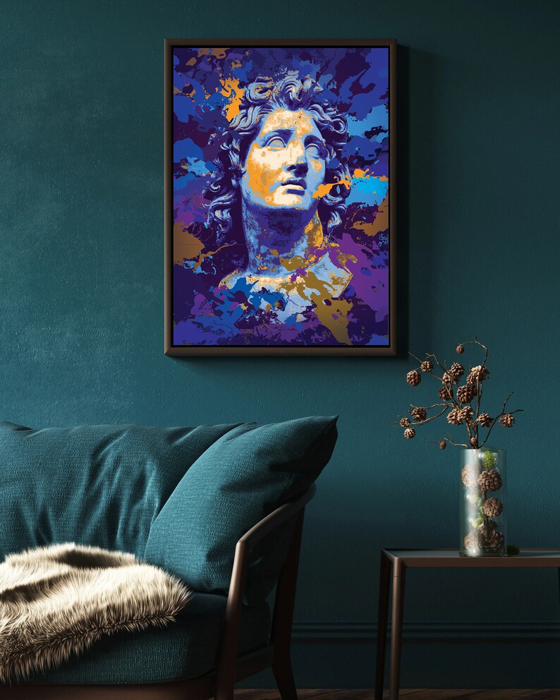 May include: A framed art print featuring a stylized bust of a classical figure. The artwork uses a vibrant color palette of blues, purples, and gold, creating a modern pop art aesthetic. The print is displayed on a teal wall.