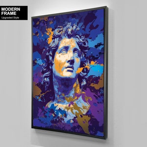 May include: Framed art print featuring a stylized bust in shades of blue, orange, and purple, with a modern abstract paint splatter design. The artwork is set against a white background and framed in black. Text on the upper left corner reads "MODERN FRAME Upgraded Style".