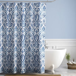 May include: A blue and white floral patterned shower curtain. The curtain features a repeating design of stylized leaves and flowers in shades of blue against a white background. The curtain is hanging in front of a white bathtub.