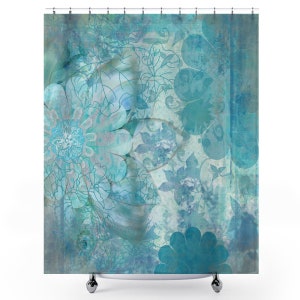 May include: A blue and white shower curtain with a floral pattern. The design features a large flower in the center with smaller flowers and leaves surrounding it. The background is a light blue with a faded, vintage look.