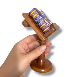 May include: A set of three ceramic mugs with a speckled, matte finish. Each mug features a different color: light blue, cream, and gray. The mugs have a simple, modern design with a rounded shape and a handle.