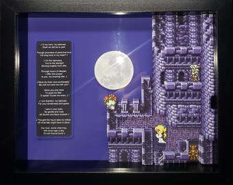 May include: Shadowbox art featuring a pixelated castle scene with a full moon and characters from a video game. The artwork includes a poem on a blue background, all framed in black.