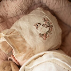 Linen baby bonnet with embroidery