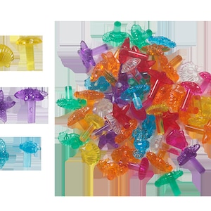 May include: Assortment of colorful plastic Christmas tree ornaments in various sea life shapes, including starfish, seashells, seahorses, and sea turtles.