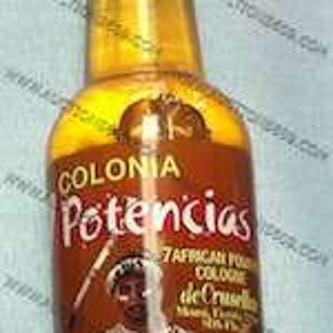May include: A brown glass bottle with a silver cap. The bottle is labeled "Colonia Potencias" and features an illustration of a person wearing a traditional African outfit. The text on the label reads "African Perfume Cologne de Oruro".