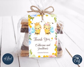 May include: Thank You Catherine and Jonathan's Gender Reveal. A white tag with a yellow honeycomb pattern and floral accents. Two cartoon bees with crowns and wings are on the tag. One bee is wearing a blue crown and the other is wearing a pink crown.