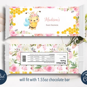 May include: A printable chocolate bar wrapper design featuring a cute cartoon bee with a crown and flowers. The wrapper is decorated with a honeycomb pattern and the text "Madison's Baby Shower".