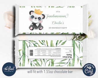 May include: A white chocolate bar wrapper with a panda bear wearing a crown and a green bamboo leaf design. The wrapper says "It's a pandamonium Charlie's 1st Birthday Party".