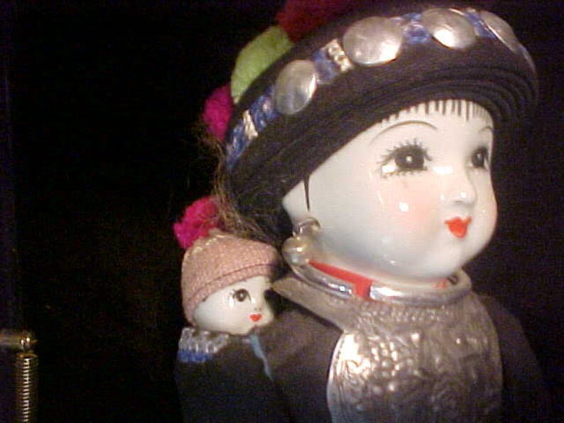 Traditional doll from Tibet or Nepal with local costume Ceramic