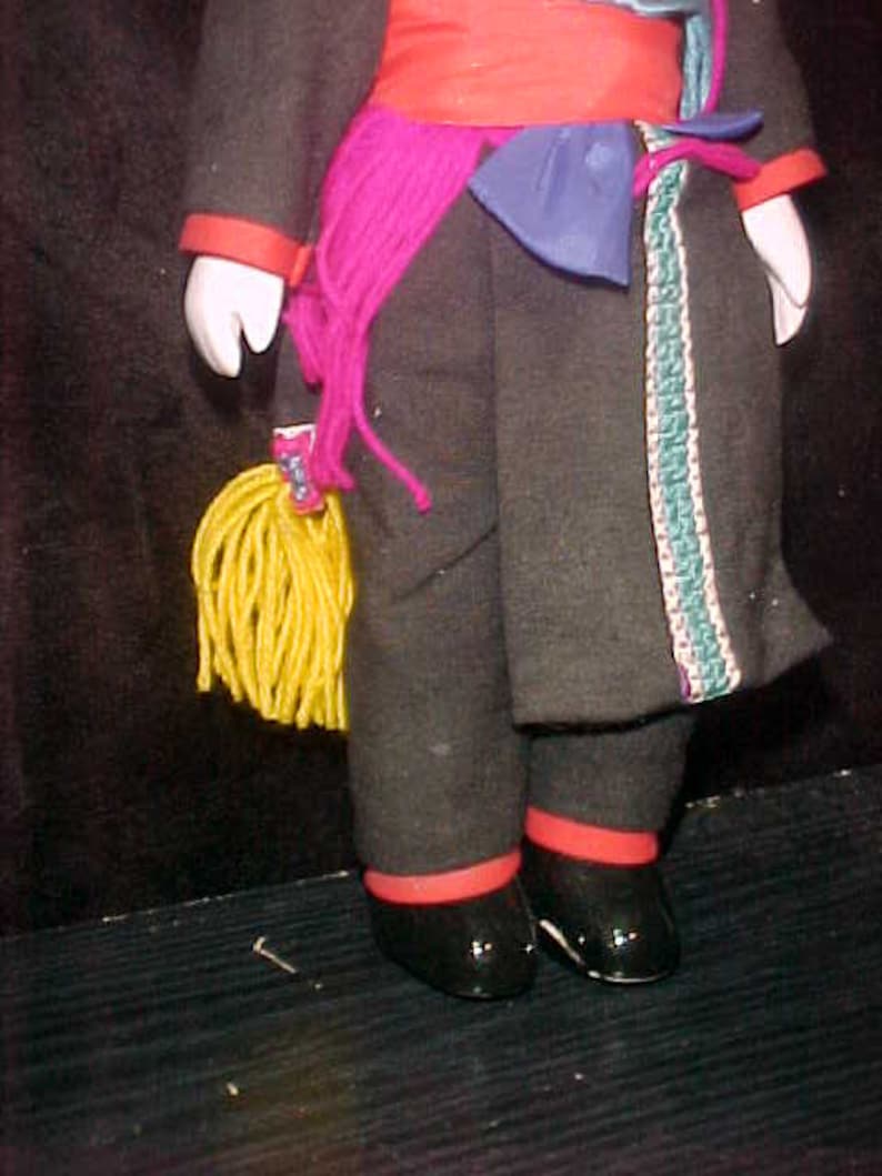 Traditional doll from Tibet or Nepal with local costume Ceramic