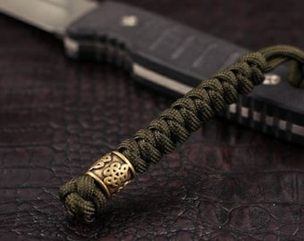 Paracord lanyard "Rondelle Chinese knot".  Hand-molded brass bead/Paracord keychain/ Custom knife paracord lanyard bead