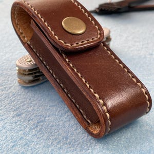 May include: A rustic wooden sign with the text "Welcome to our home" in white lettering. The sign features a distressed finish and a simple, inviting design, perfect for front door decor.