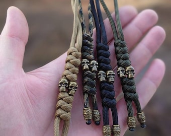 Paracord strap lanyard for a knife or keys with two skull beads