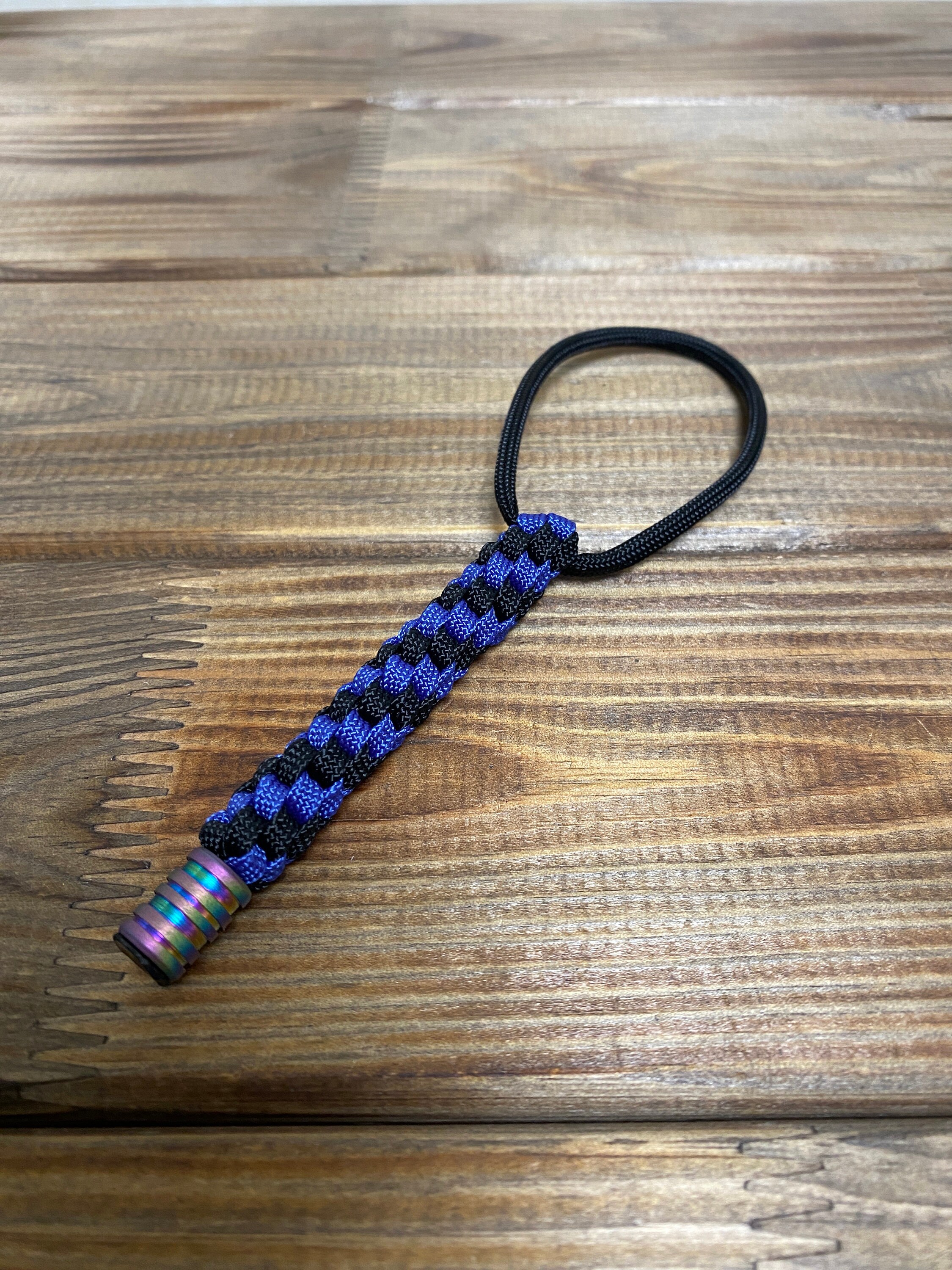Paracord lanyard, Helix Black Navy blue.  With titanium bead
