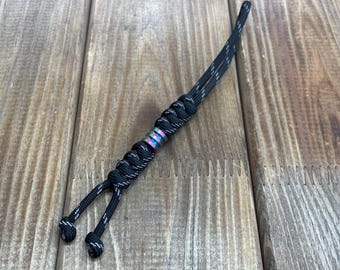 Reflective paracord lanyard, Zeus Black.  With a small titanium bead