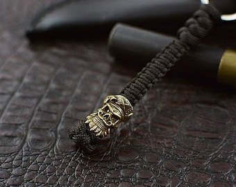 Keychain from paracord, "BLACK BEARD".  Hand-cast brass bead