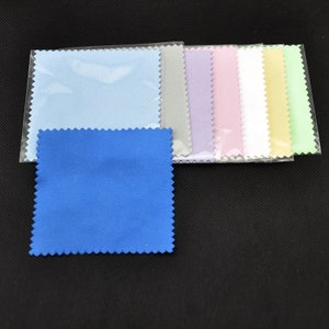 May include: A set of ten microfiber cleaning cloths in various colors, including light blue, gray, lavender, pink, white, yellow, and green. The cloths are packaged in clear plastic.
