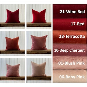 May include: Six different colored velvet pillow covers, arranged in three rows of two. The colors are wine red, red, terracotta, deep chestnut, blush pink, and baby pink.