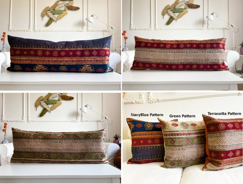 May include: Three long decorative pillows with different patterns. The pillows are on a white couch. The pillows are made of a woven fabric with a red, blue, and green color scheme. The pillows are labeled "NavyBlue Pattern", "Green Pattern", and "Terracotta Pattern".