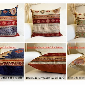 May include: Three decorative throw pillows with different color patterns. The front of each pillow features a geometric design in navy, terracotta, and green tones. The back of each pillow is a solid color in navy, terracotta, and beige.