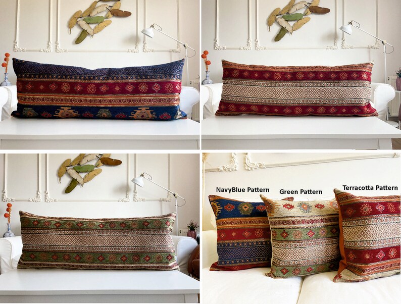 May include: Three long decorative pillows with different patterns. The pillows are on a white couch. The pillows are made of a woven fabric with a red, blue, and green color scheme. The pillows are labeled "NavyBlue Pattern", "Green Pattern", and "Terracotta Pattern".