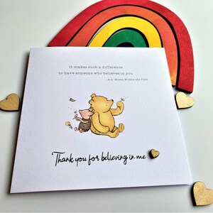 6 x 6 inch Handmade Winnie the Pooh Thank you teacher card. Features a laser cut wooden heart, an AA Milne quote and a classic Winnie the Pooh image. This card is personalised