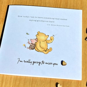 6 x 6 inch Winnie the Pooh Miss You Card featuring a classic Winnie the Pooh image, a laser-cut wooden heart and an AA Milne quote