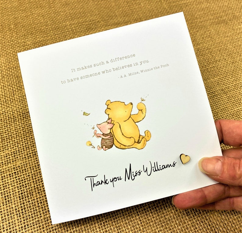 6 x 6 inch Handmade Winnie the Pooh Thank you teacher card. Features a laser cut wooden heart, an AA Milne quote and a classic Winnie the Pooh image. This card is personalised