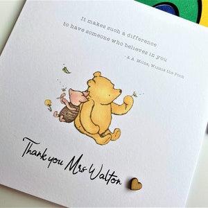 6 x 6 inch Handmade Winnie the Pooh Thank you teacher card. Features a laser cut wooden heart, an AA Milne quote and a classic Winnie the Pooh image. This card is personalised