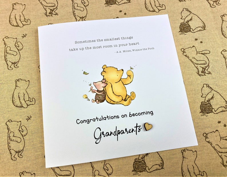 6 x 6 inch Handmade Winnie the Pooh Congratulations on becoming Grandparents card. Features a laser cut wooden heart, an AA Milne quote and a classic Winnie the Pooh image