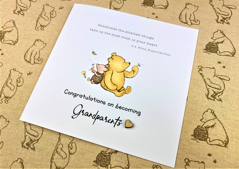 6 x 6 inch Handmade Winnie the Pooh Congratulations on becoming Grandparents card. Features a laser cut wooden heart, an AA Milne quote and a classic Winnie the Pooh image